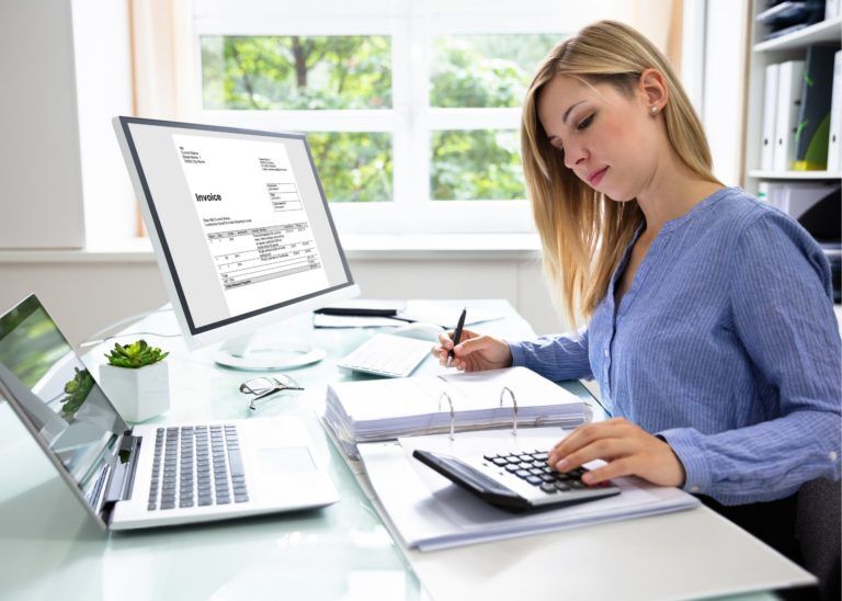 Bookkeeper working at organized desk